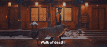 a man walking with a wolf that says walk of death on it