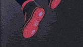 a blue light is coming out of a shoe on a dark background