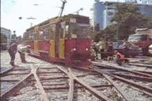 a red and yellow train with the number 80 on the front