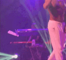 a man stands on stage with a drum that says lucky day on it