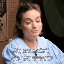 a woman in a blue dress is saying no we didn 't no we didn 't !