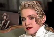 Madonna Putting On Glasses GIF - Madonna Putting On Glasses Eyeglasses GIFs