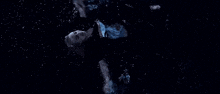 a dark blue background with a lot of water splashing