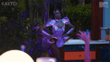 a woman in a purple dress is standing in front of a counter with a mtv logo in the corner