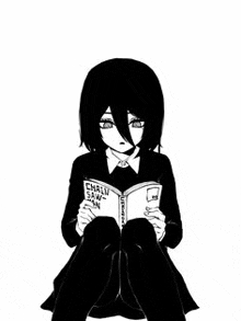 a girl is sitting down reading a book .