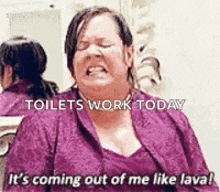 a woman in a purple dress is sitting in a bathroom and screaming .