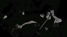 a person with bandages on their arms is holding a sword