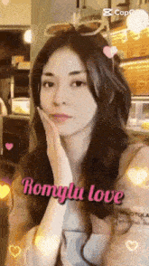 a woman with romylu love written on the bottom of her face