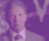 a man in a suit and tie looks at the camera with a purple background