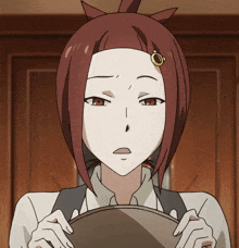 a girl with red hair and a ring in her hair