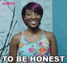 a woman with purple hair is smiling with the words to be honest behind her