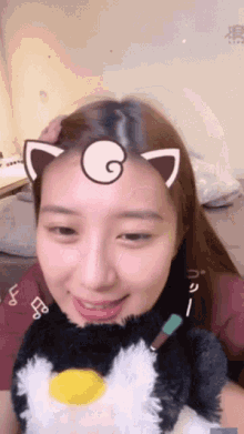 a woman with a cat ear on her head