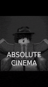 a man in a suit and hat is sitting in a chair with the words absolute cinema above him