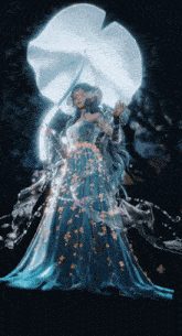 a woman in a blue dress is holding a white flower