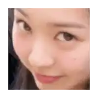 a close up of a woman 's face with a red lip and a black spot on her cheek .