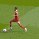a soccer player with the number 10 on his jersey is laying on the field