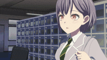a girl in a suit and tie is standing in front of lockers