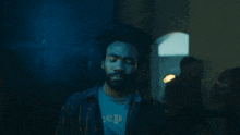 a man with a beard wears a shirt that says jeep