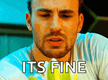 a close up of a man 's face with the words " it 's fine " below him