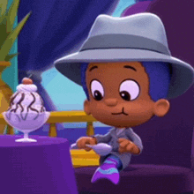 a cartoon character in a hat sits at a table with a bowl of ice cream