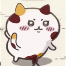 a cartoon cat with three different colored spots on its face is walking on the ground .