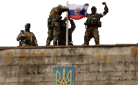 a group of soldiers standing on top of a brick wall holding a russian flag