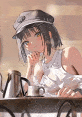 a girl sitting at a table with a cup of coffee and a tattoo on her arm that says disney express