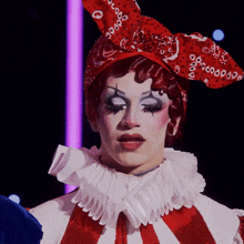 a close up of a person wearing a clown costume