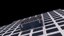 a cube with the letter k on it sits on a grid