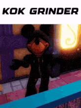 a picture of mickey mouse wearing a black hoodie with the words kok grinder on the top