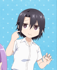 a girl with short black hair and purple eyes is pointing to her face