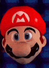 a close up of a mario face with a red hat and mustache .