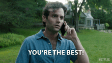 a man talking on a cell phone with the words you 're the best on the bottom
