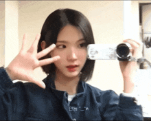 a girl is taking a picture of herself in the mirror