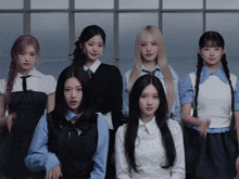 a group of young women are posing for a picture together