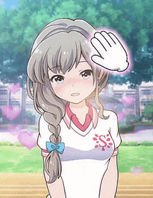 a girl with a braided hair and a white shirt is standing in a park with a hand on her head .