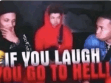 a group of men are standing in front of a sign that says " if you laugh you go to hell "