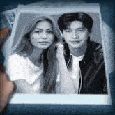a black and white photo of a man and a woman on a newspaper