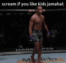a shirtless ufc fighter celebrates his victory in a boxing ring