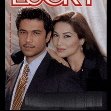 a man in a suit and tie stands next to a woman on the cover of a magazine called look