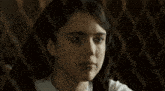 a close up of a woman 's face and hands