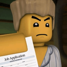 a lego man is holding a job application in his hand