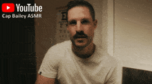 a man with a mustache is on a youtube video