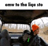 a man in an orange hat is sitting in the back seat of a vehicle with the words omw to tha liqa sto on the bottom