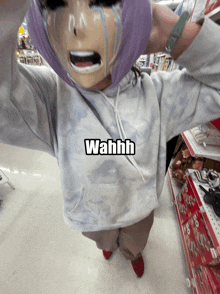 a person wearing a hoodie that says wahhh on it