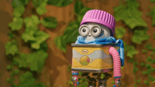 a cartoon character is wearing a pink hat and scarf while standing next to a can of jellyfish