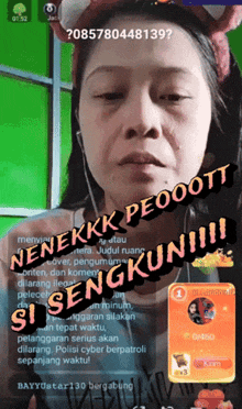 a woman 's face is displayed on a screen with the words nenekkk peooott si sengkun !!! written on it