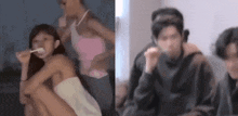 a woman in a towel is brushing her teeth with a spoon and a group of people are sitting in a room .