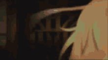 a blurry picture of a person 's hand in a dark room .