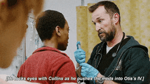 a doctor is talking to a patient in a hospital room while holding a syringe and a stethoscope .